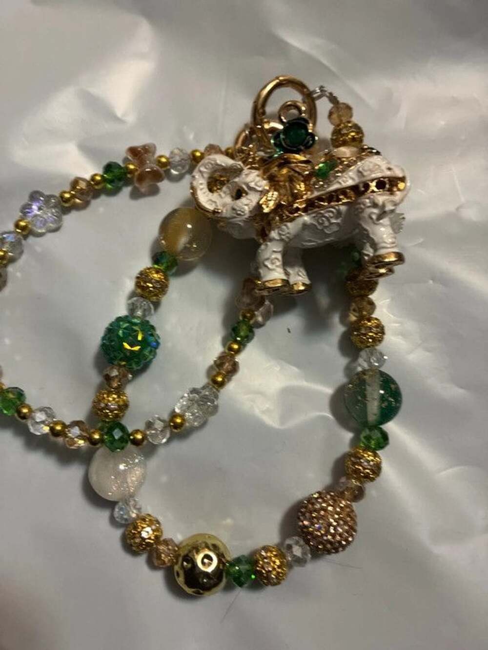Gold tone beaded white elephant bag charm chain